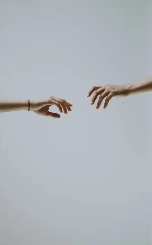 two hands about to hold wallpaper